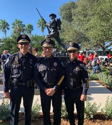 Vero Beach Officers in Front of Statue